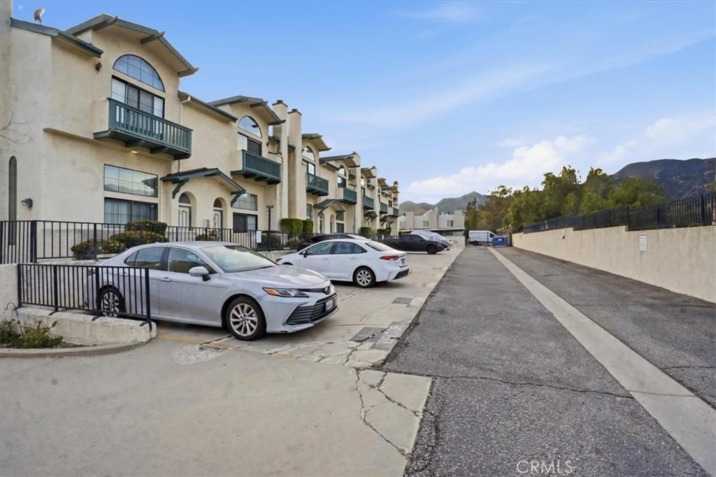 14325 Foothill Boulevard, Unit 9 Sylmar, CA 91342 - Photo 37 of 43 a view of multiple houses with a street