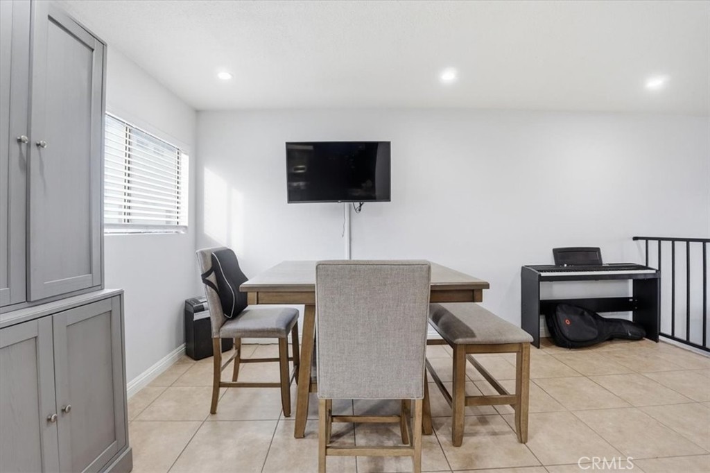 14325 Foothill Boulevard, Unit 9 Sylmar, CA 91342 - Photo 9 of 43 a living room with furniture a flat screen tv and a window