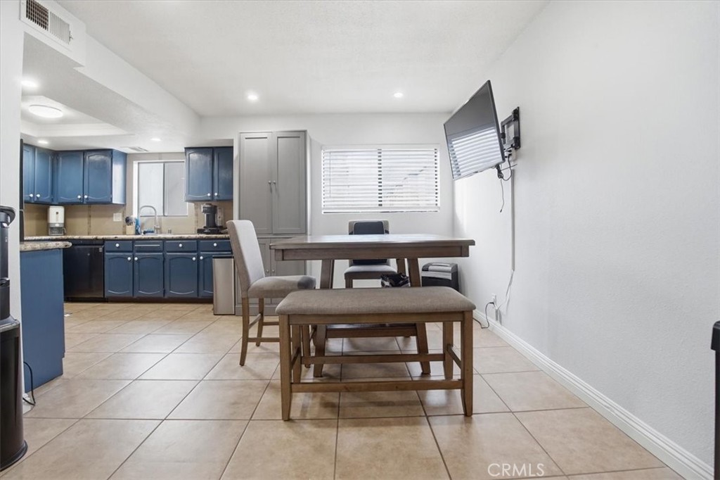 14325 Foothill Boulevard, Unit 9 Sylmar, CA 91342 - Photo 10 of 43 a kitchen with a cabinets and chairs