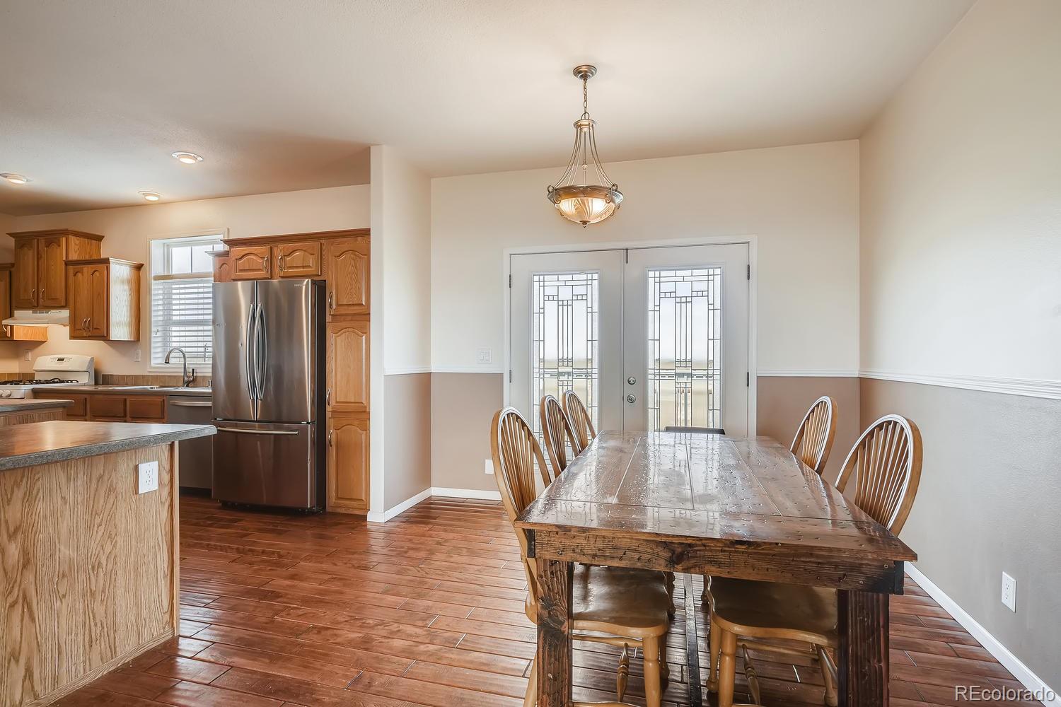 14750 Berridge Road Ramah, CO 80832 - Photo 13 of 40 a view of a dining room with furniture window and wooden floor