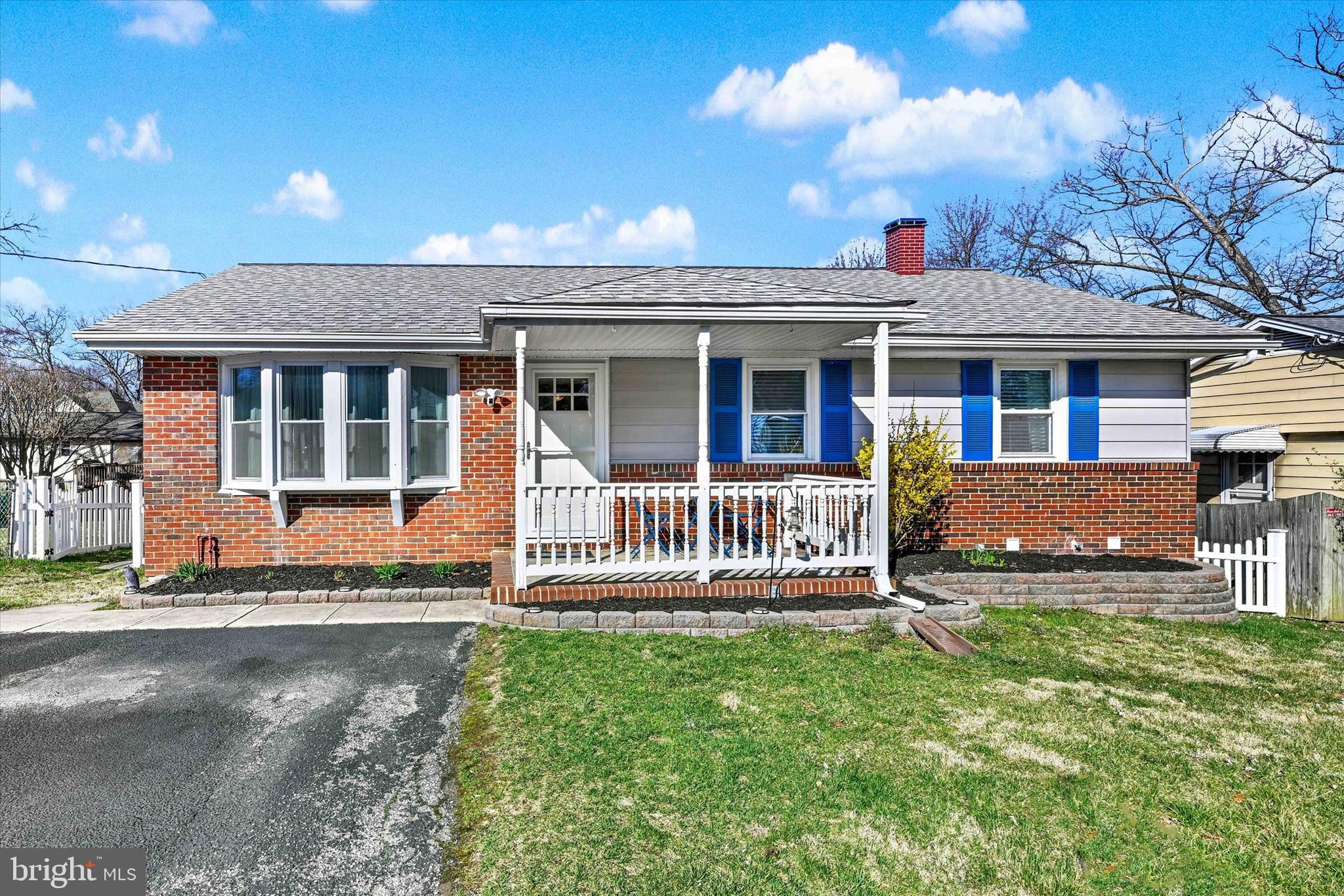 9630 10th Avenue Baltimore, MD 21234 - Photo 1 of 35 a front view of a house with a yard