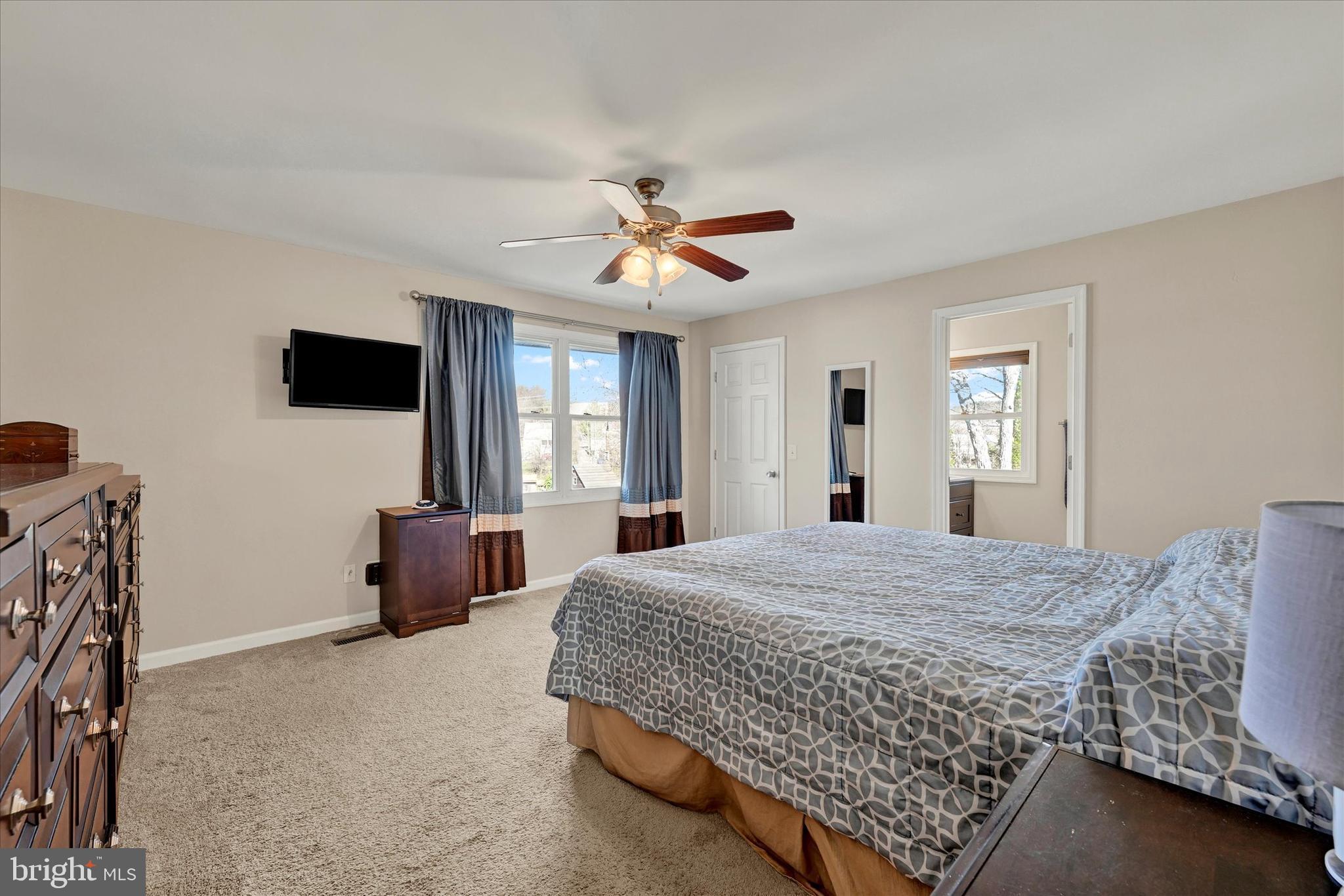 9630 10th Avenue Baltimore, MD 21234 - Photo 15 of 35 a bedroom with a bed and a flat screen tv