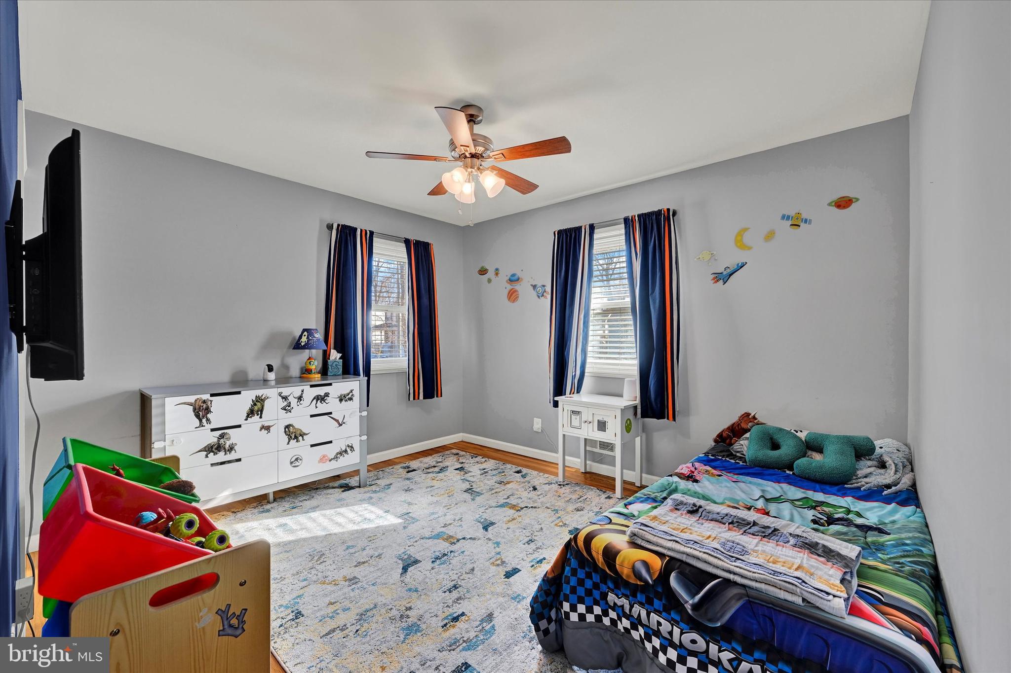 9630 10th Avenue Baltimore, MD 21234 - Photo 19 of 35 a bedroom with furniture and a flat screen tv