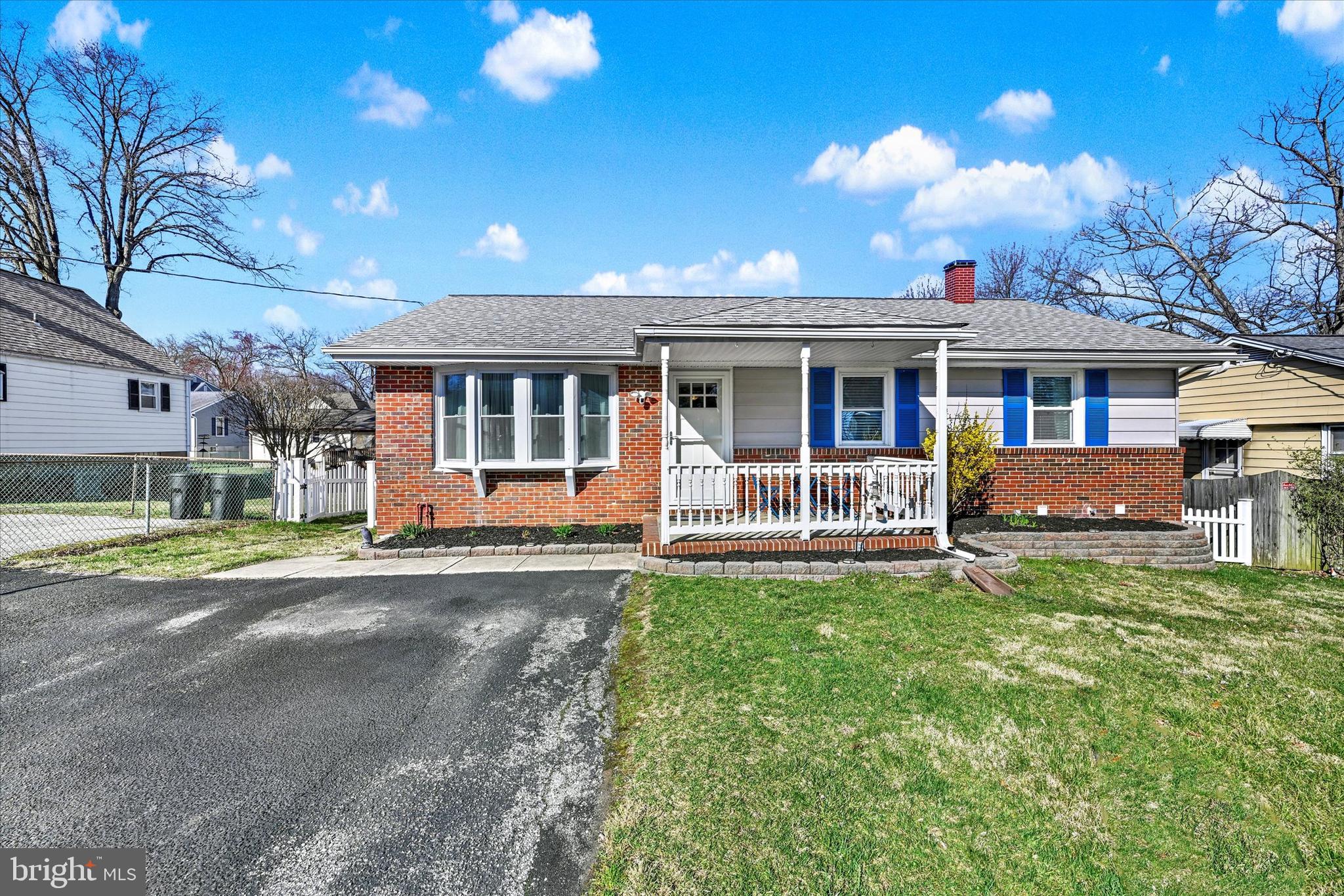9630 10th Avenue Baltimore, MD 21234 - Photo 2 of 35 a view of a house with a yard and sitting area