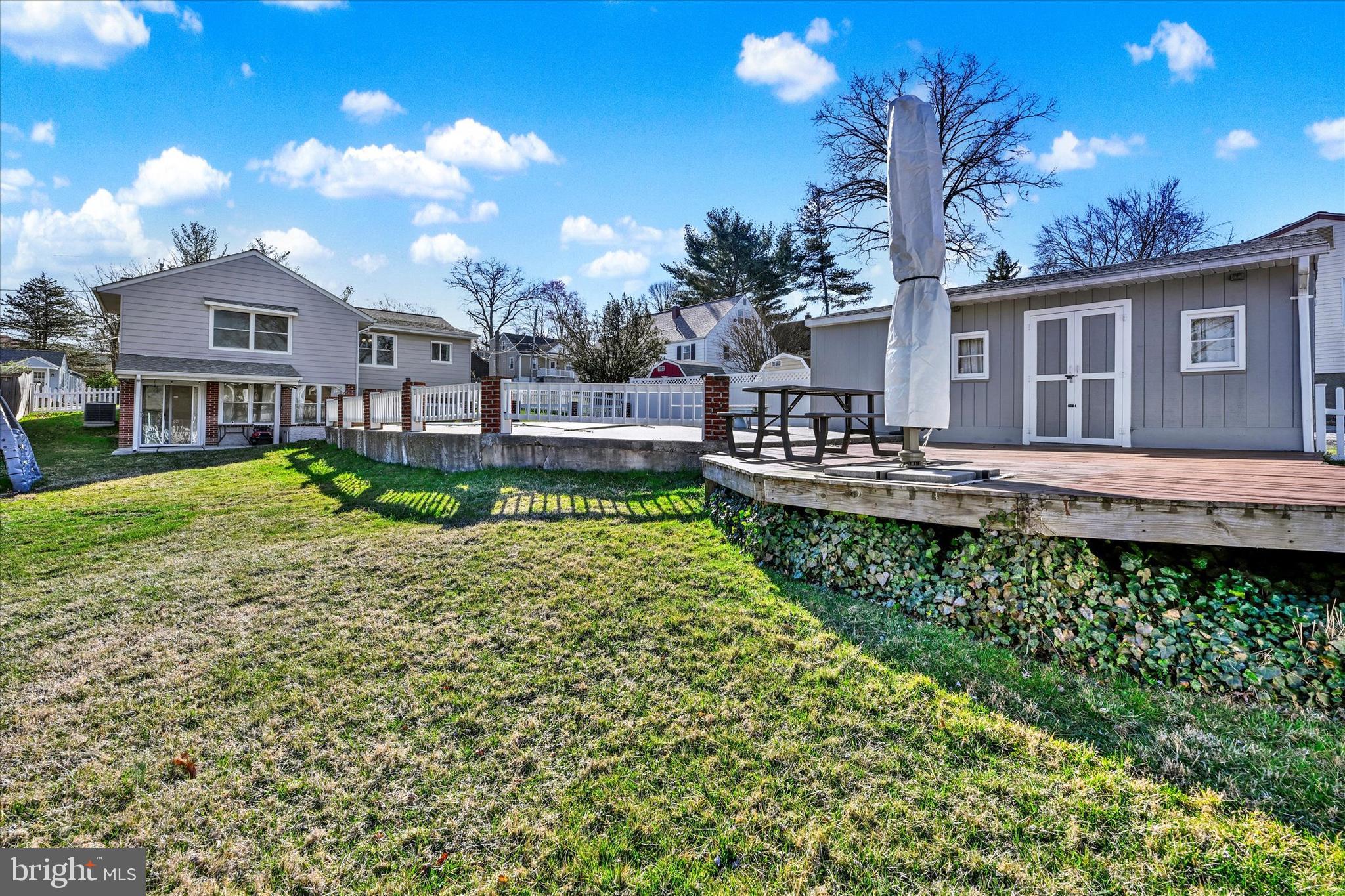 9630 10th Avenue Baltimore, MD 21234 - Photo 27 of 35 a front view of a house with garden