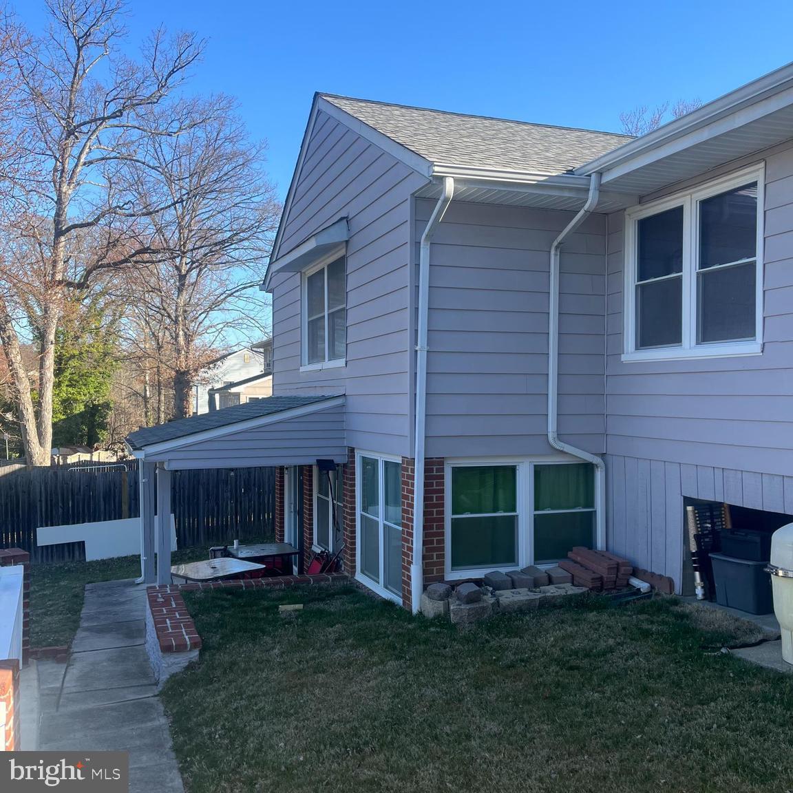 9630 10th Avenue Baltimore, MD 21234 - Photo 34 of 35 a view of a house with a yard and a fireplace