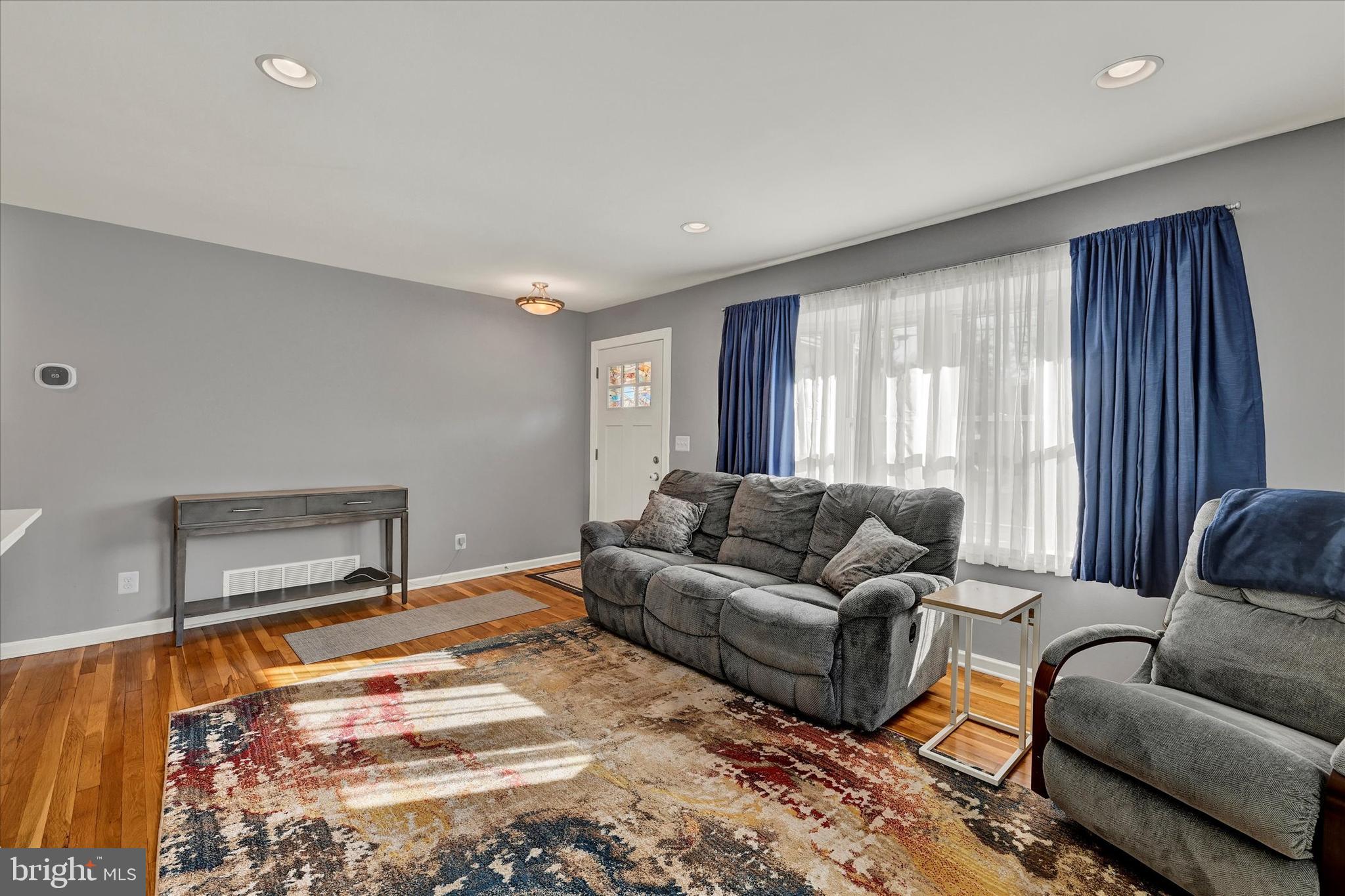 9630 10th Avenue Baltimore, MD 21234 - Photo 5 of 35 a living room with furniture and a window