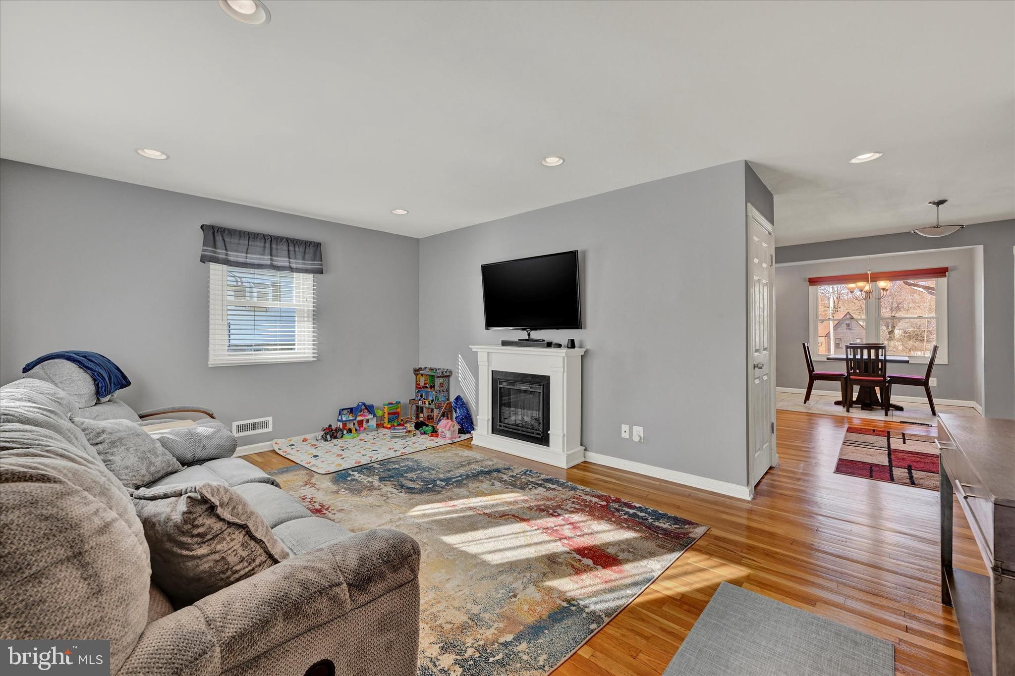 9630 10th Avenue Baltimore, MD 21234 - Photo 6 of 35 a bedroom with a bed and a flat screen tv