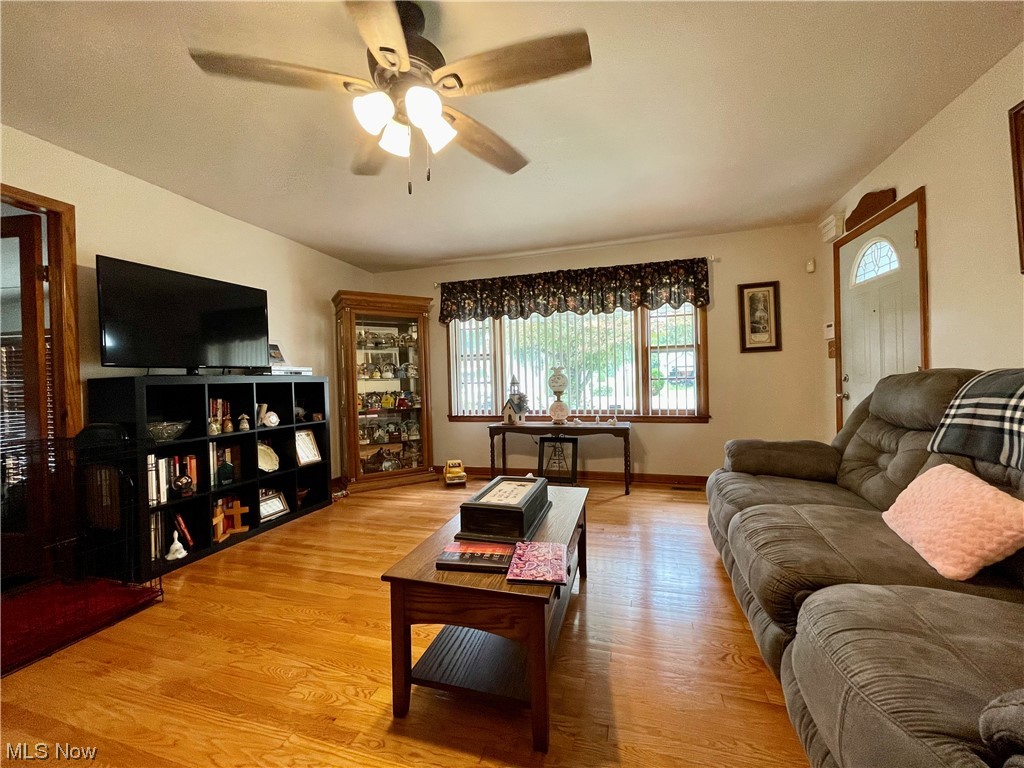66119 Highway 124 Reedsville, OH 45772 - Photo 4 of 29 Hardwood floored living room featuring ceiling fan