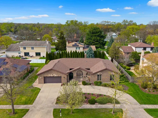 an aerial view of residential houses with outdoor space and street view