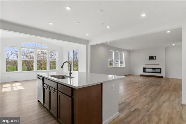 a kitchen with sink and cabinets