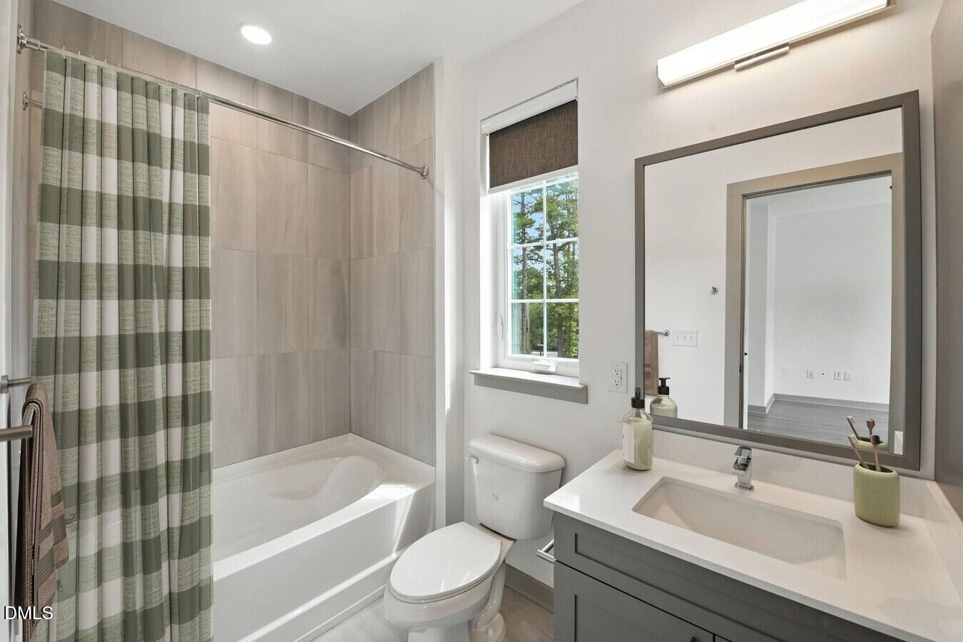 1000 Martin Luther King Junior Boulevard, Unit B7 Chapel Hill, NC 27514 - Photo 6 of 12 a bathroom with a sink a toilet and shower