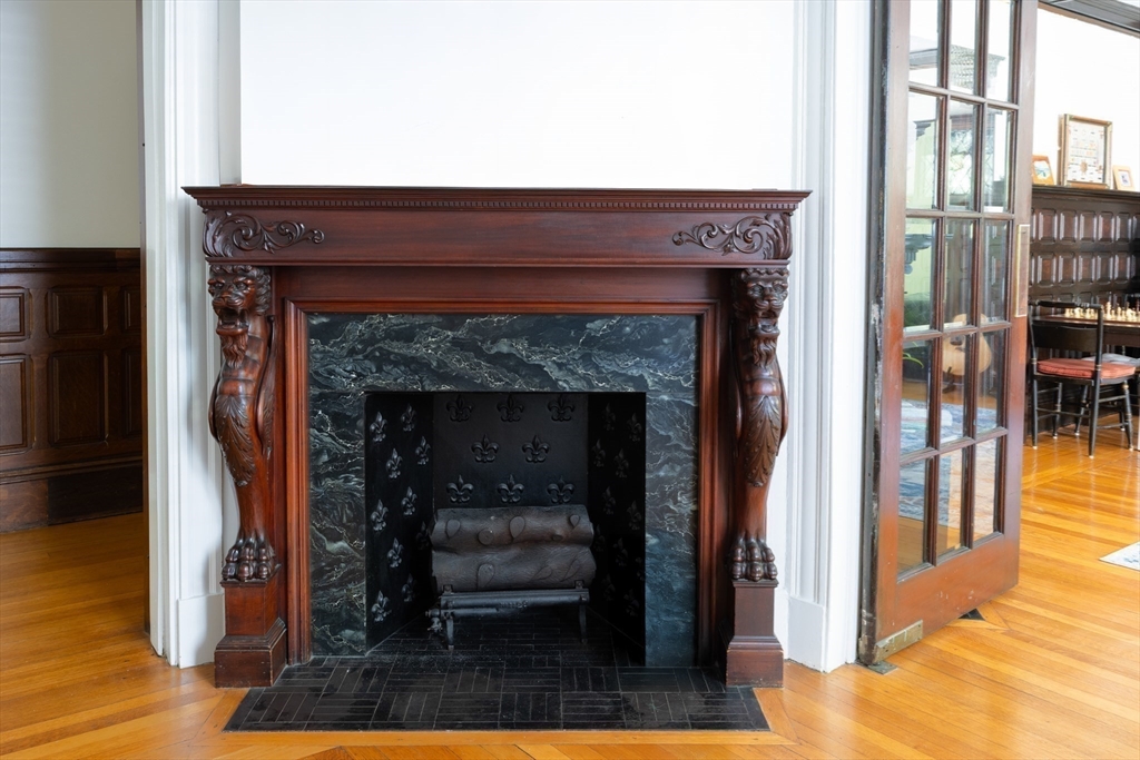 51 Naples Road Brookline, MA 02446 - Photo 13 of 16 a living room with furniture and a fireplace