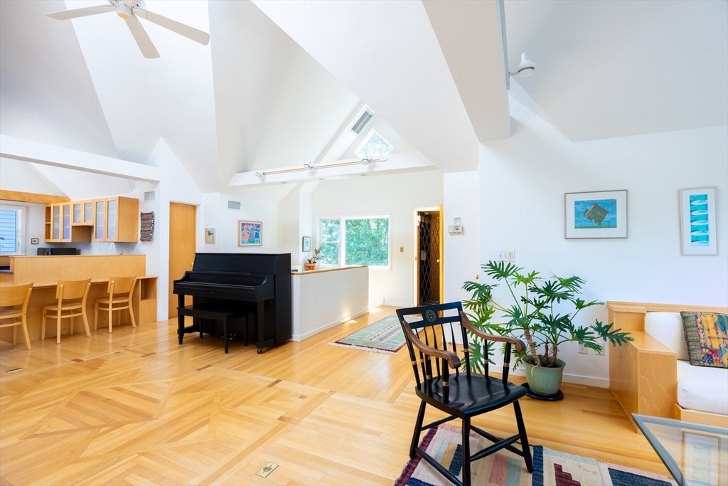 51 Naples Road Brookline, MA 02446 - Photo 4 of 16 a living room with furniture and a kitchen view