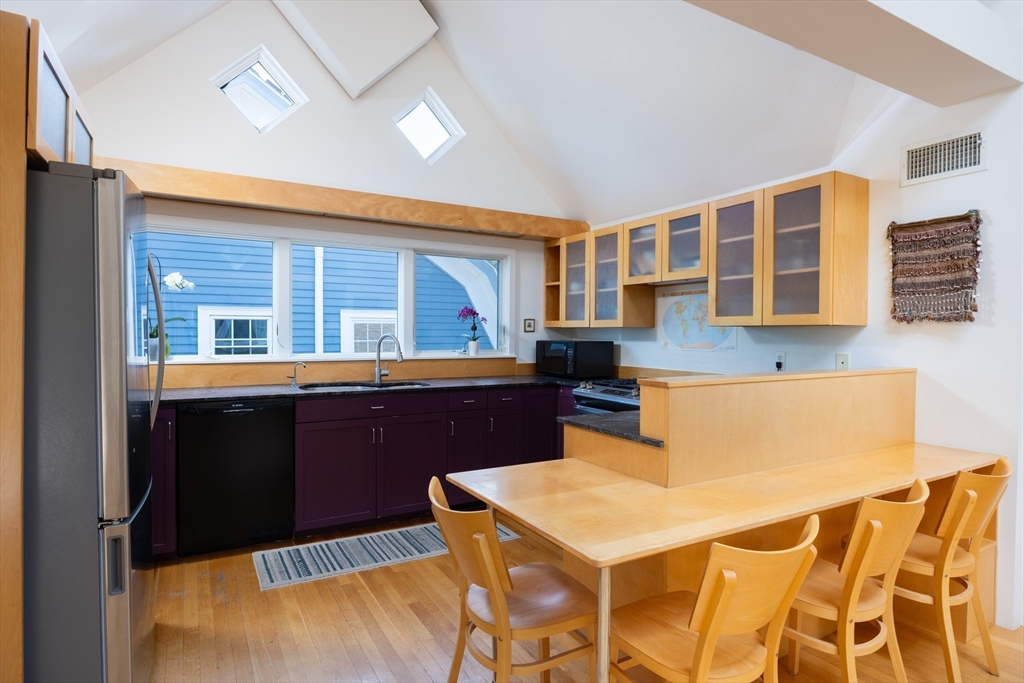 51 Naples Road Brookline, MA 02446 - Photo 5 of 16 a kitchen with a appliances and cabinets