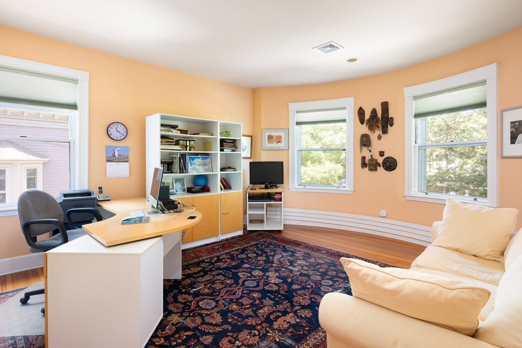 51 Naples Road Brookline, MA 02446 - Photo 10 of 16 a living room with furniture and a window