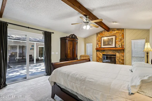 a bathroom with a granite countertop sink two mirror and a