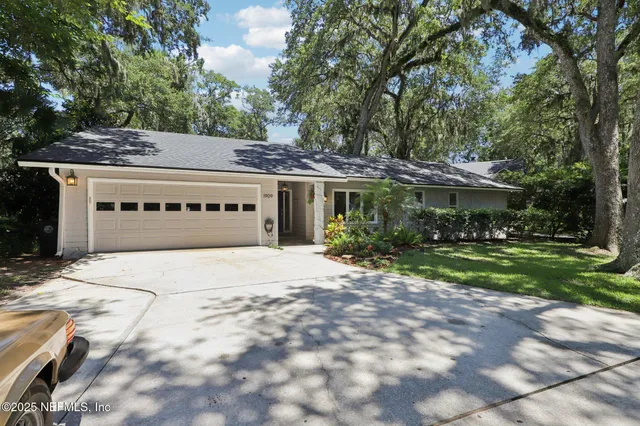 a view of a entryway door with a chandelier