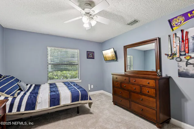 a view of a patio with table and chairs with wooden floor and fence