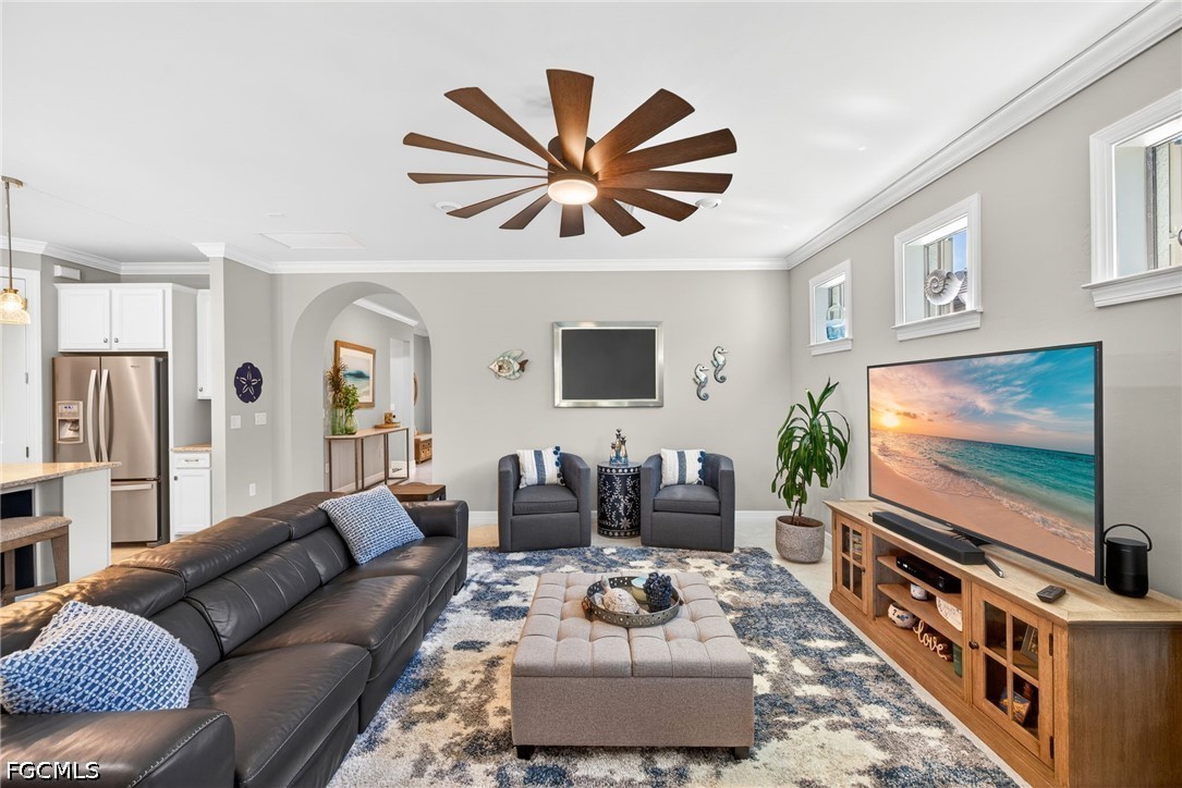 11932 Bourke Place Fort Myers, FL 33913 - Photo 11 of 44 a living room with furniture and a flat screen tv