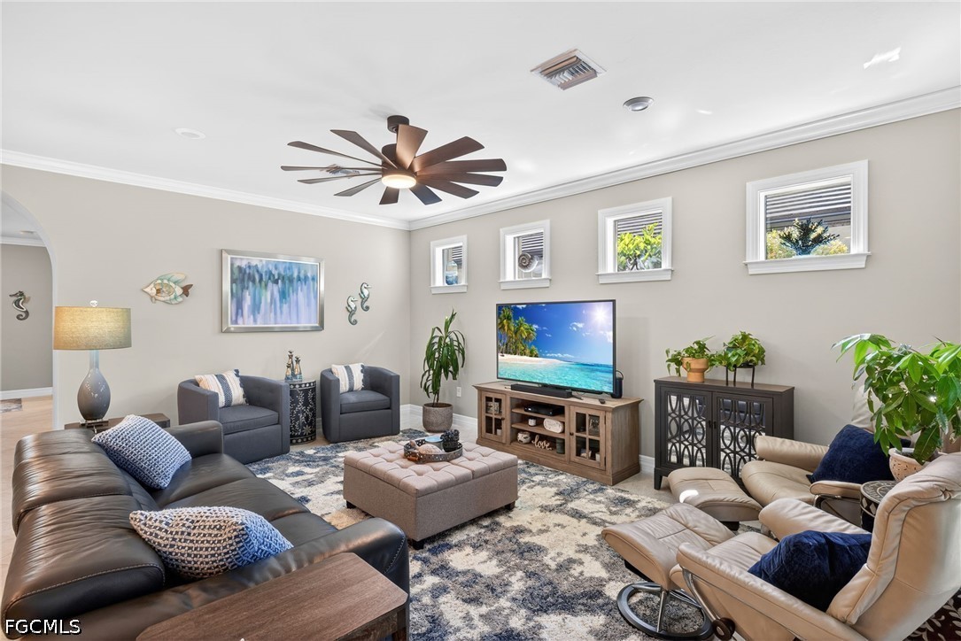 11932 Bourke Place Fort Myers, FL 33913 - Photo 12 of 44 a living room with furniture and a flat screen tv