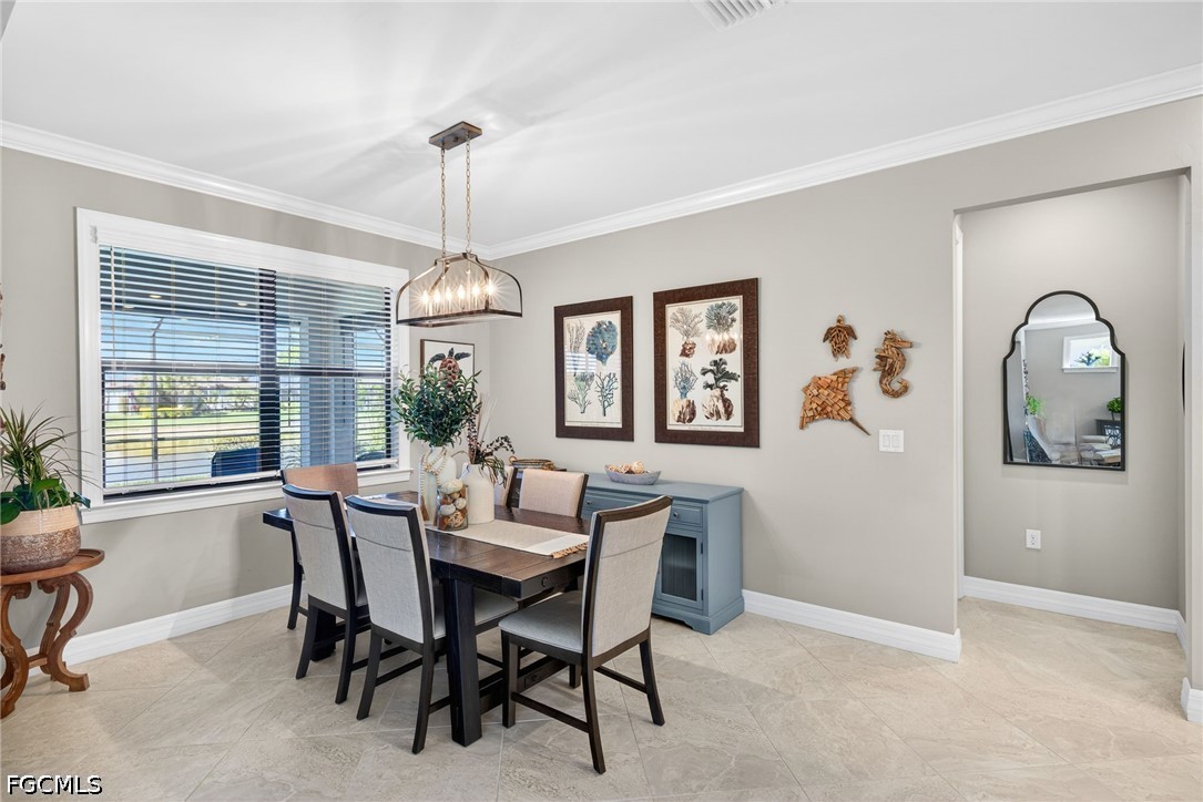 11932 Bourke Place Fort Myers, FL 33913 - Photo 15 of 44 a dining room with furniture window and wooden floor