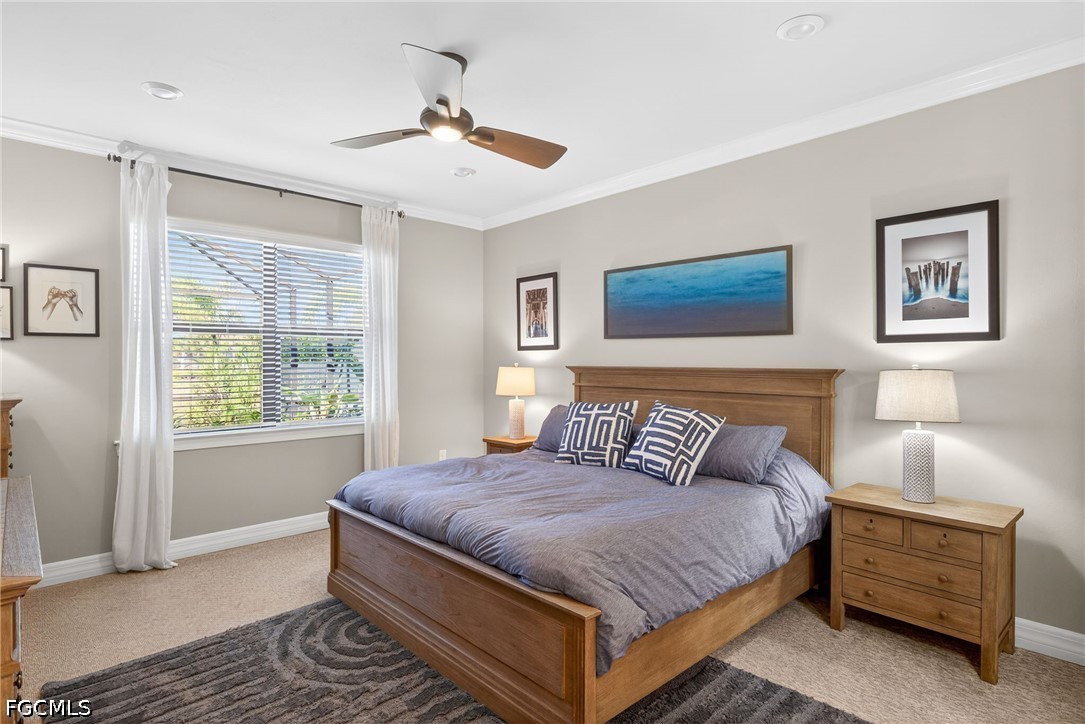 11932 Bourke Place Fort Myers, FL 33913 - Photo 18 of 44 a bedroom with a large bed and a window