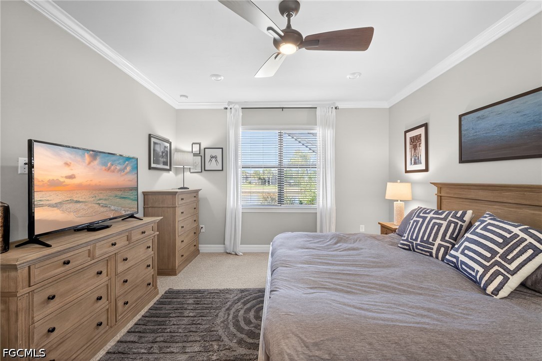 11932 Bourke Place Fort Myers, FL 33913 - Photo 20 of 44 a bedroom with a bed and a flat screen tv