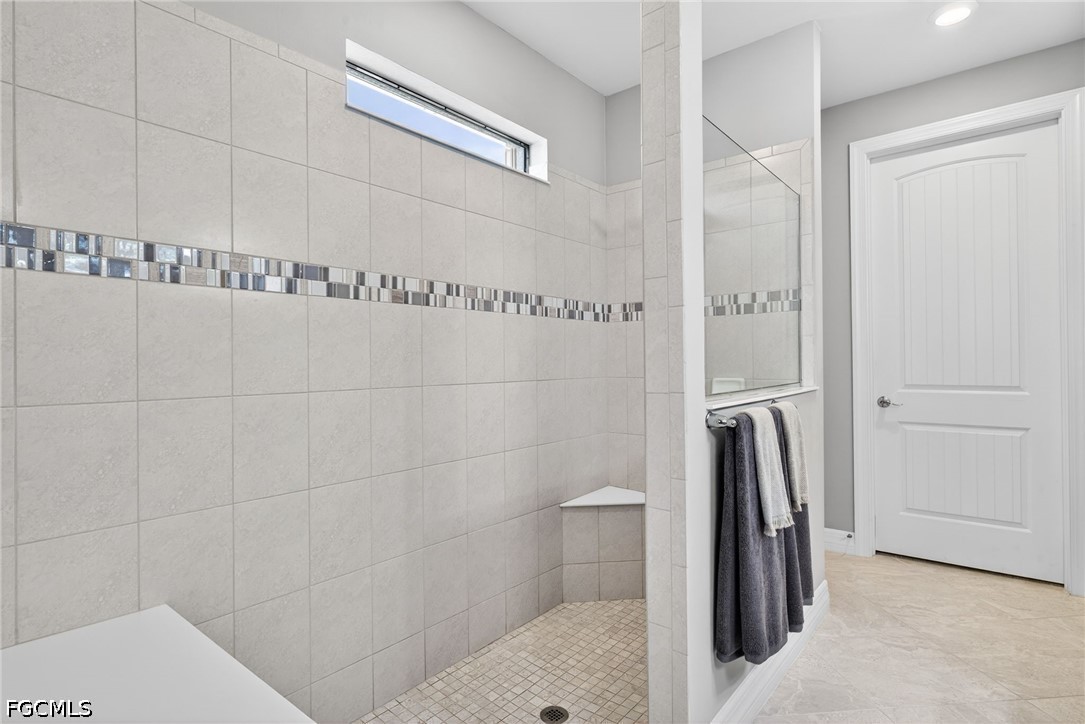 11932 Bourke Place Fort Myers, FL 33913 - Photo 22 of 44 a bathroom with a shower and toilet