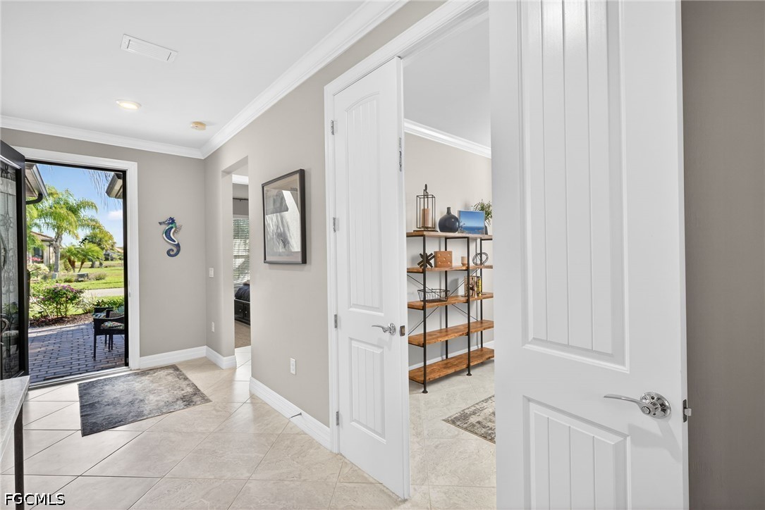 11932 Bourke Place Fort Myers, FL 33913 - Photo 27 of 44 a living room with furniture and a book shelf