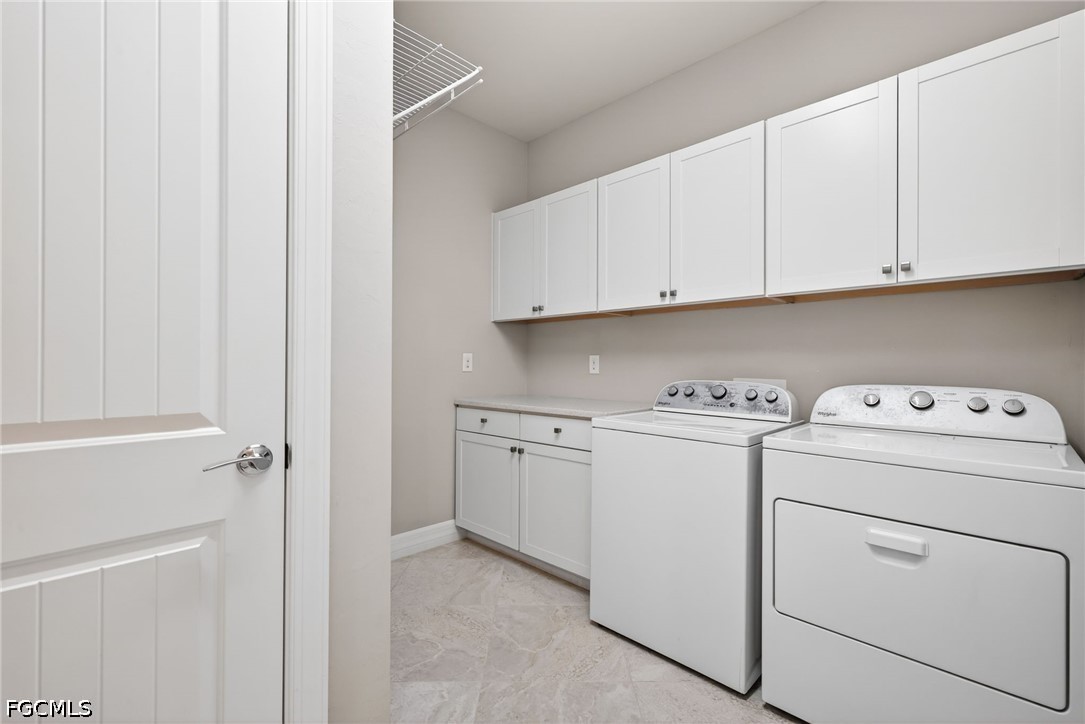 11932 Bourke Place Fort Myers, FL 33913 - Photo 28 of 44 a view of storage and utility room with washer and dryer