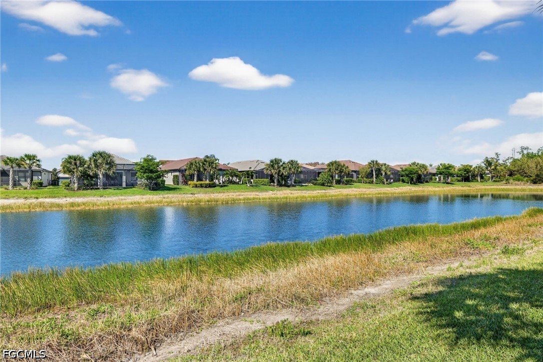 11932 Bourke Place Fort Myers, FL 33913 - Photo 33 of 44 a view of a lake with houses in the back