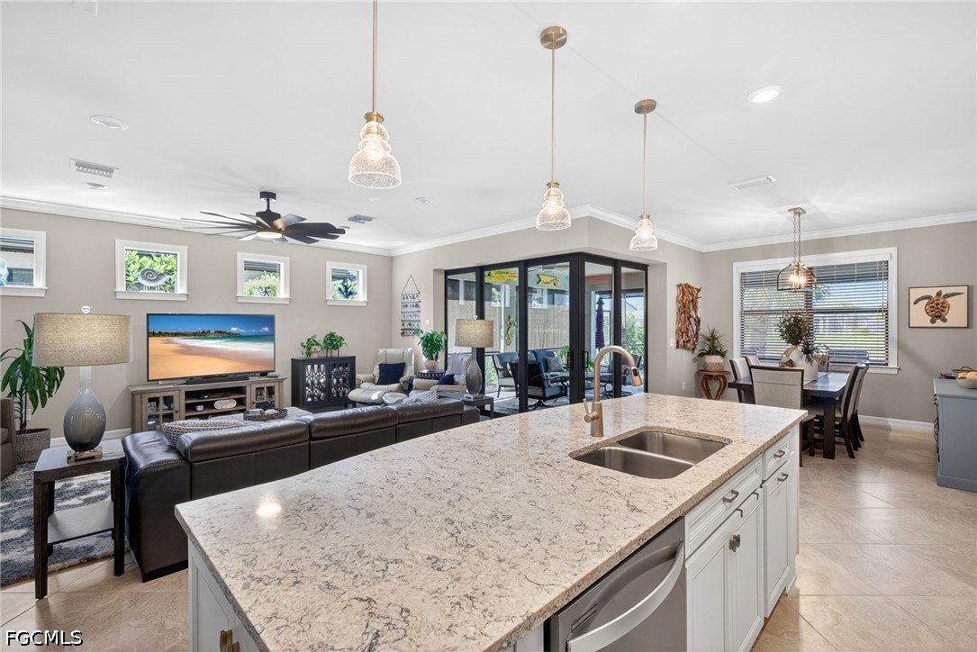 11932 Bourke Place Fort Myers, FL 33913 - Photo 9 of 44 a kitchen with stainless steel appliances granite countertop a sink a stove and a table