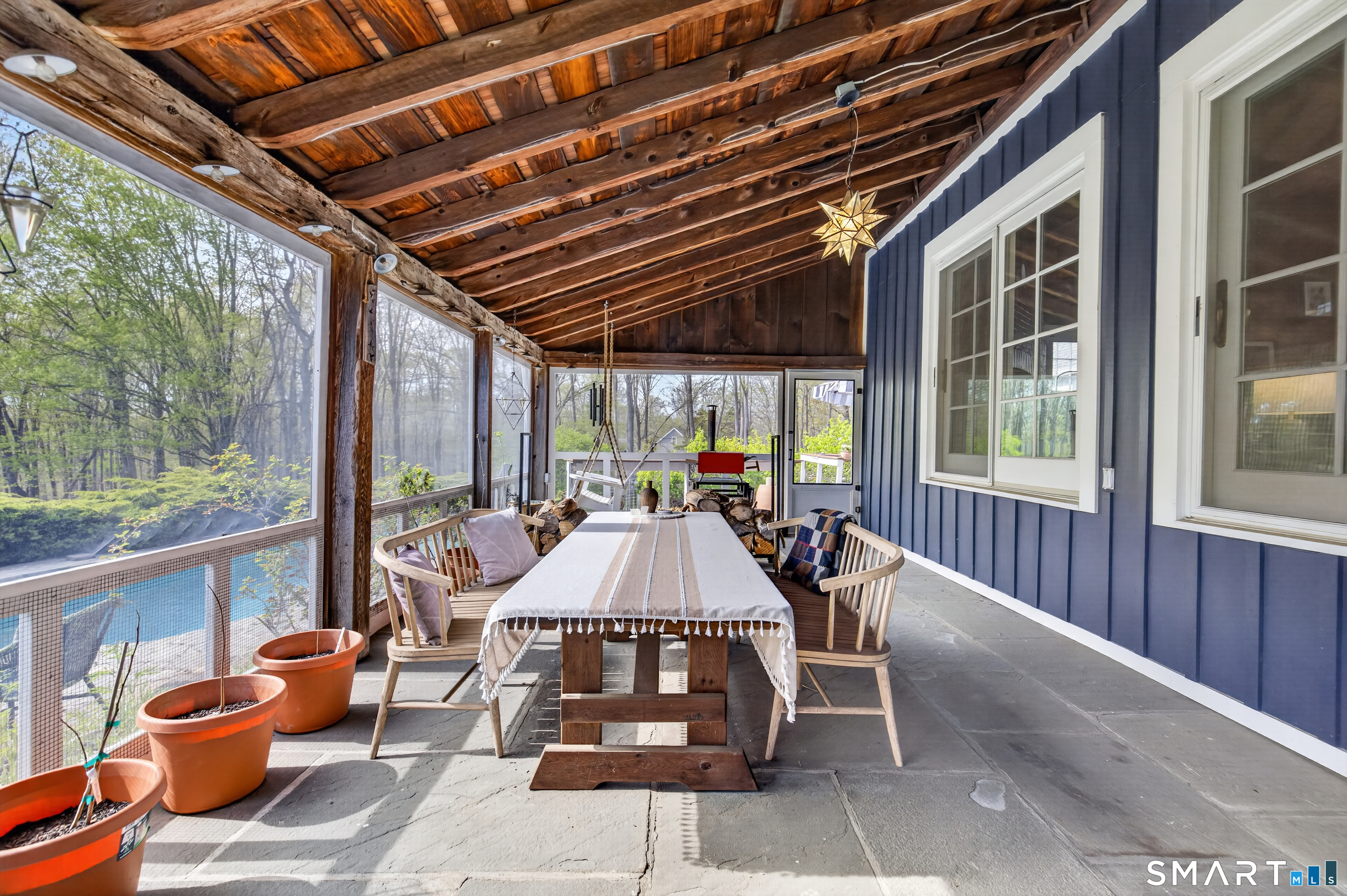 95 Chestnut Hill Road Killingworth, CT 06419 - Photo 34 of 40 Beautiful blue stone enclosed screened-in porch with vaulted ceilings.