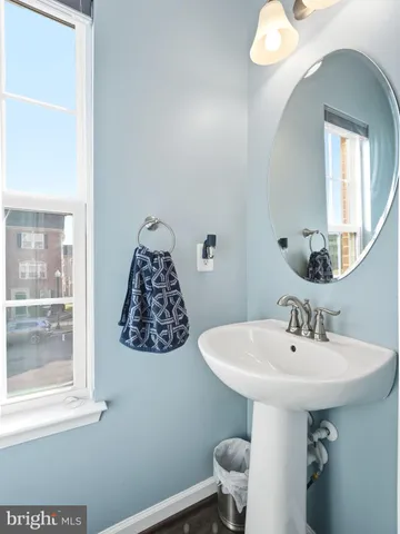 a bathroom with a sink a mirror and a toilet