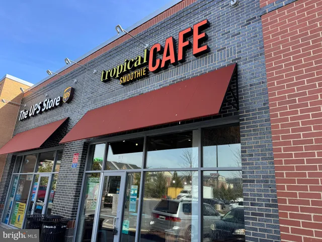 a street sign on a brick wall