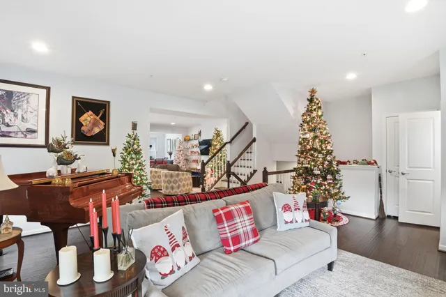 a living room with furniture and flowers