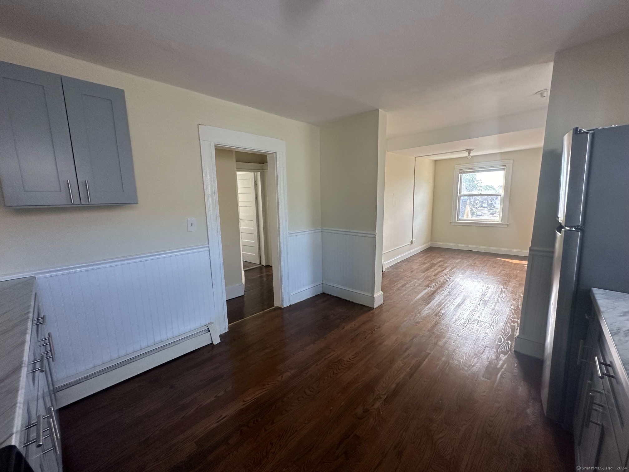 40 Vine Street, Unit 3 Bridgeport, CT 06604 - Photo 3 of 14 a view of a room with wooden floor and a window