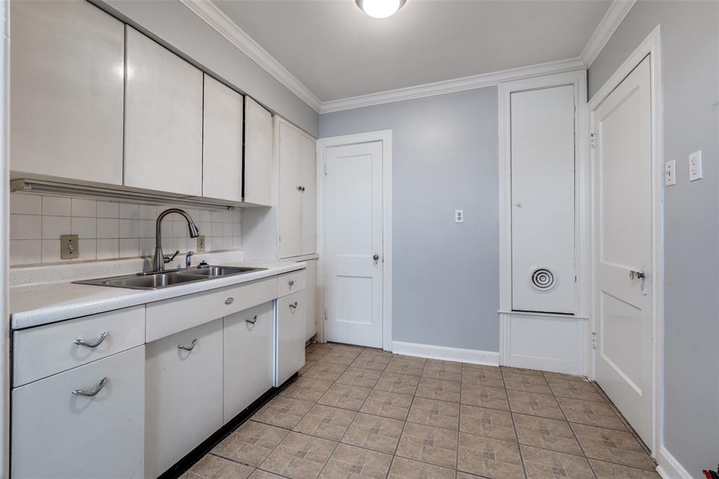 4501-4503 Highview Street Cockrell Hill, TX 75211 - Photo 22 of 24 a kitchen with a sink and cabinets