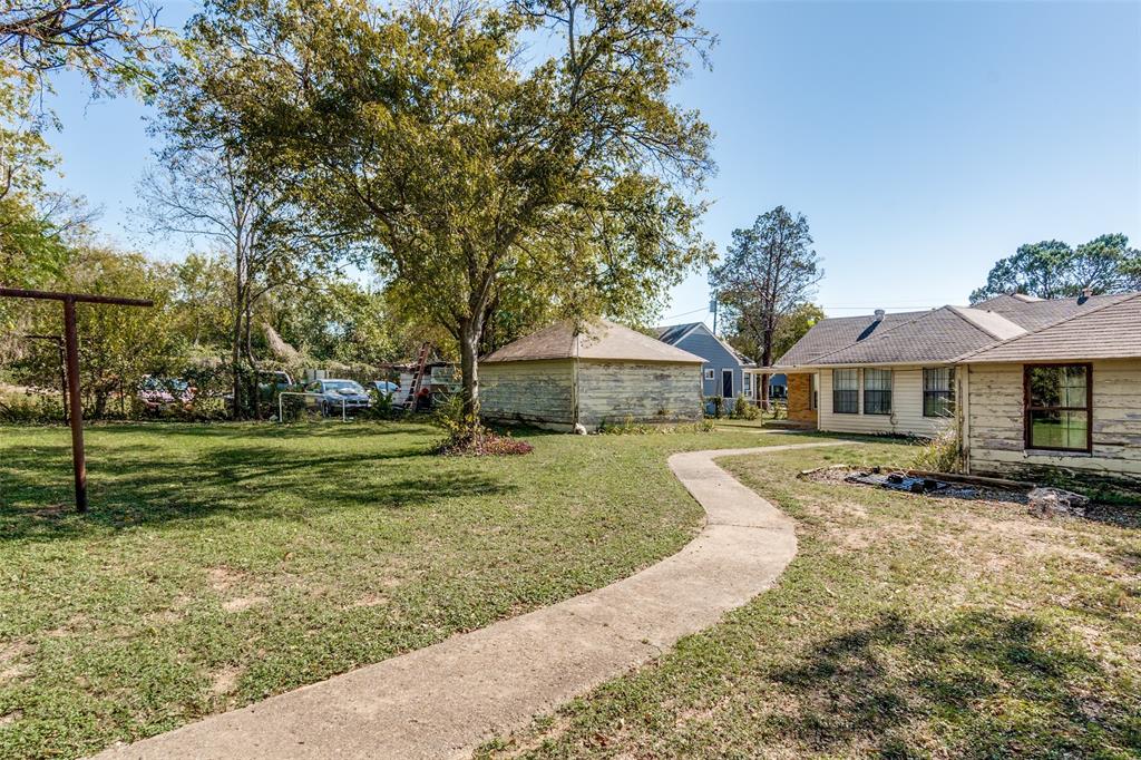 4501-4503 Highview Street Cockrell Hill, TX 75211 - Photo 24 of 24 a front view of a house with garden