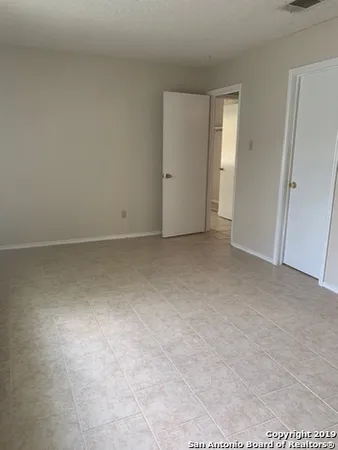 an empty room with an entryway