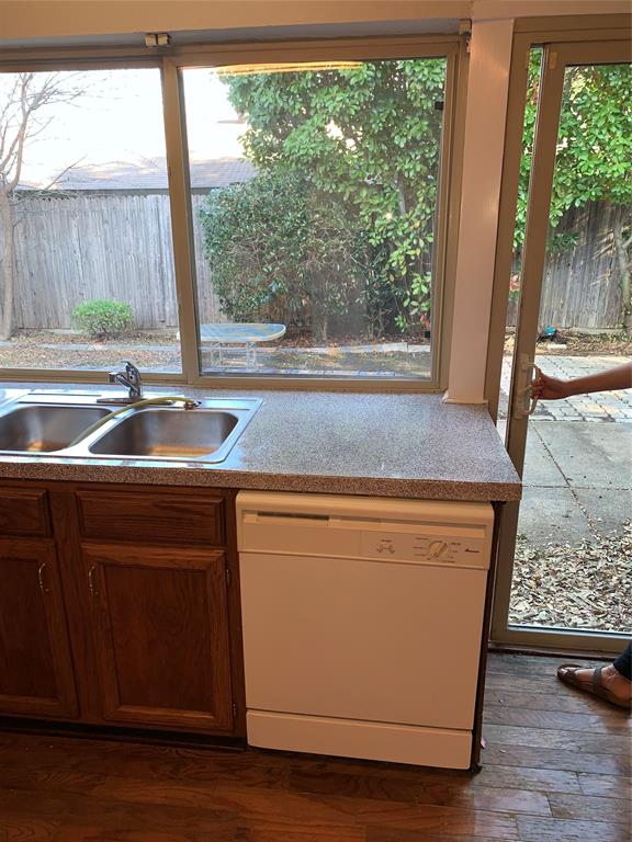 1605 Spanish Trail Plano, TX 75023 - Photo 3 of 5 a view of sink and microwave with wooden floor