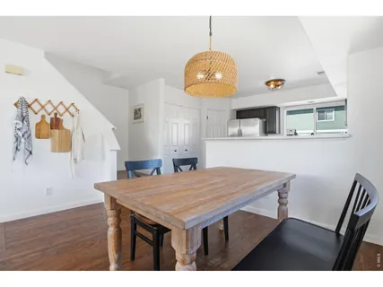 a living room with a table and chairs