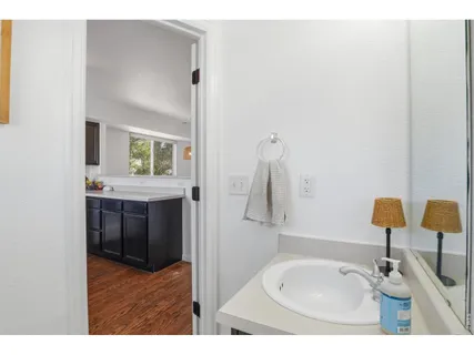 a bathroom with a sink and a mirror