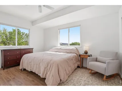 a bedroom with a bed and a couch