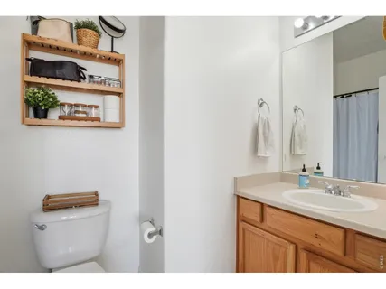 a bathroom with a sink a vanity and a mirror