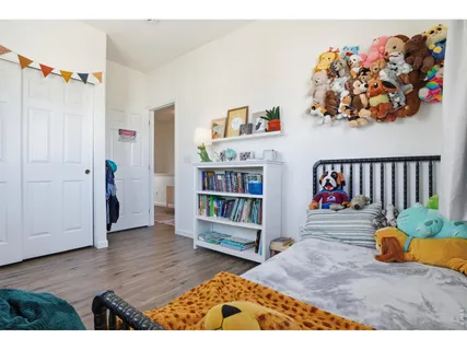 a view of an entryway with wooden floor