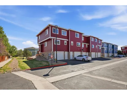 a car parked in front of a brick house