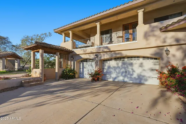 a spacious bedroom with a bed and large window
