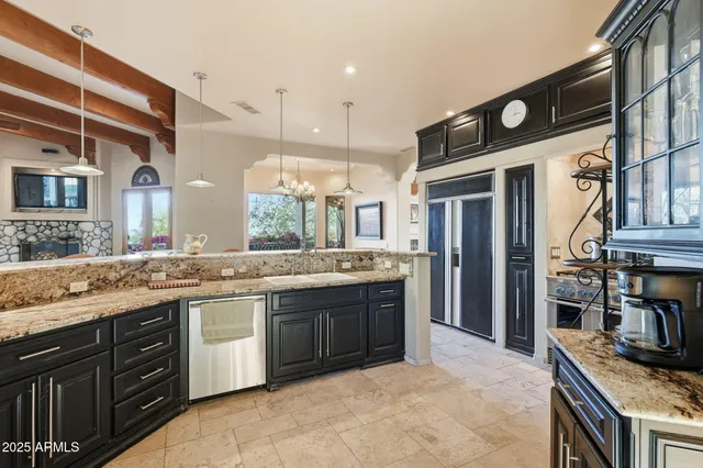 a front view of a house with garden and trees